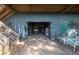 Spacious garage with golf cart, storage, and fishing equipment, conveniently located under the house at 226 Old House Ln, Dewees Island, SC 29451