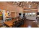 Spacious living area with wooden floors, vaulted ceilings, and an inviting dining table for entertaining at 226 Old House Ln, Dewees Island, SC 29451