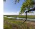 Scenic marsh view featuring a winding waterway and lush vegetation, showcasing the natural beauty at 226 Old House Ln, Dewees Island, SC 29451