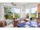 Bright breakfast nook with tiled counters and picturesque views of the surrounding nature at 226 Old House Ln, Dewees Island, SC 29451