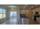 Modern kitchen featuring white cabinetry, stainless steel appliances, and an island with a breakfast bar at 259 Huguenot Trl, Huger, SC 29450