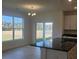Bright kitchen with an island, open to the backyard and dining area with modern fixtures at 259 Huguenot Trl, Huger, SC 29450