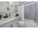 Well-lit bathroom featuring modern vanity, bathtub with tiled walls, and stylish decor at 2608 Seymour Ave, North Charleston, SC 29405