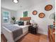 Serene bedroom with natural light, stylish decor, and comfortable furnishings create a calming and inviting space at 2608 Seymour Ave, North Charleston, SC 29405