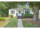 Charming, quaint single-story home featuring a walkway, black shutters, and a well-maintained front yard at 2608 Seymour Ave, North Charleston, SC 29405