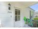 Close up of front porch and door on single-story white house with black shutters at 2608 Seymour Ave, North Charleston, SC 29405