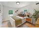 Inviting bedroom with a comfortable bed, stylish headboard, neutral tones, and ample natural light, creating a relaxing retreat at 2608 Seymour Ave, North Charleston, SC 29405
