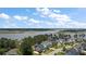 Stunning aerial view of waterfront homes with marsh views and lush landscaping on a sunny day at 2879 River Vista Way, Mount Pleasant, SC 29466