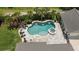 Aerial view of the backyard, showcasing the pool, spa, lush landscaping, and patio area for outdoor living at 2879 River Vista Way, Mount Pleasant, SC 29466