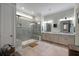 Luxurious bathroom with a large glass shower, dual vanities, and elegant fixtures at 2879 River Vista Way, Mount Pleasant, SC 29466