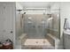Modern tile shower showcasing dual shower heads and built-in bench seating at 2879 River Vista Way, Mount Pleasant, SC 29466