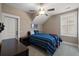 Comfortable bedroom featuring neutral colors, a ceiling fan, and shuttered windows at 2879 River Vista Way, Mount Pleasant, SC 29466