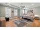 Serene bedroom with tray ceiling, hardwood floors, and plenty of natural light at 2879 River Vista Way, Mount Pleasant, SC 29466