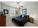 Comfortable bedroom featuring a ceiling fan and a comfortable bed with dark bedding and carpet flooring at 2879 River Vista Way, Mount Pleasant, SC 29466