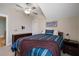 Cozy bedroom featuring a ceiling fan and a comfortable bed with striped bedding and wood furniture at 2879 River Vista Way, Mount Pleasant, SC 29466