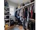 Walk-in closet with built-in shelving, rods, and hardwood flooring at 2879 River Vista Way, Mount Pleasant, SC 29466