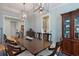 Well-lit dining room featuring a large table, unique lighting fixtures, and stylish décor at 2879 River Vista Way, Mount Pleasant, SC 29466