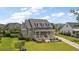 Charming two-story home with a welcoming front porch, landscaped yard, and classic architectural details at 2879 River Vista Way, Mount Pleasant, SC 29466