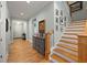 Hallway and staircase featuring hardwood floors and painted walls at 2879 River Vista Way, Mount Pleasant, SC 29466
