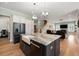 Spacious kitchen with large island, stainless steel refrigerator, and open floor plan at 2879 River Vista Way, Mount Pleasant, SC 29466