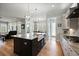 Bright, open kitchen with hardwood floors, a farmhouse sink, and modern appliances at 2879 River Vista Way, Mount Pleasant, SC 29466