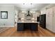 Modern kitchen with a spacious center island, stylish lighting, and stainless steel appliances at 2879 River Vista Way, Mount Pleasant, SC 29466