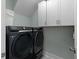 Contemporary laundry area equipped with front load washer and dryer at 2879 River Vista Way, Mount Pleasant, SC 29466
