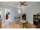Cozy living room with a ceiling fan, hardwood floors, and a gray sofa at 2879 River Vista Way, Mount Pleasant, SC 29466