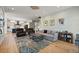 Open-concept living room showcasing hardwood floors, comfortable seating, and stylish decor accents at 2879 River Vista Way, Mount Pleasant, SC 29466