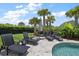 Beautiful pool area featuring lounge chairs and lush landscaping, creating a perfect spot for relaxation at 2879 River Vista Way, Mount Pleasant, SC 29466