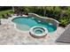 Inviting backyard pool and spa area with a decorative stone waterfall feature at 2879 River Vista Way, Mount Pleasant, SC 29466