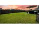 Large grassy backyard, enclosed by a wooden fence at 291 Lucca Dr, Summerville, SC 29486