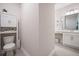 Half bathroom featuring a white cabinet, toilet, and vanity is conveniently located on the main level at 291 Lucca Dr, Summerville, SC 29486