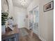 Welcoming entryway with wood flooring, decorative rug, and French doors to the office at 291 Lucca Dr, Summerville, SC 29486