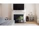 Living room fireplace with decorative mantle, television, and neutral decor, offering a cozy ambiance at 291 Lucca Dr, Summerville, SC 29486