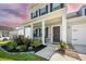 Inviting front porch with elegant landscaping and classic architectural details at 291 Lucca Dr, Summerville, SC 29486