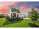 Charming two-story home with well-maintained landscaping and covered front porch at 291 Lucca Dr, Summerville, SC 29486