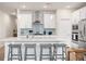 Bright kitchen features a large island with bar seating, stainless appliances, and ample cabinet space at 291 Lucca Dr, Summerville, SC 29486