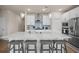 Bright kitchen features a large island with bar seating, stainless appliances, and ample cabinet space at 291 Lucca Dr, Summerville, SC 29486