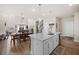 Open concept kitchen flows into dining area and living room at 291 Lucca Dr, Summerville, SC 29486