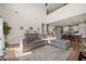 Spacious living room with neutral sectional sofa and view into open kitchen and dining room at 291 Lucca Dr, Summerville, SC 29486