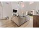 Bright living room with a cozy fireplace, high ceilings, and large sliding glass doors at 291 Lucca Dr, Summerville, SC 29486