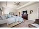 Spacious main bedroom with plush carpet, tray ceiling, and ceiling fan offers a relaxing retreat at 291 Lucca Dr, Summerville, SC 29486