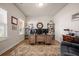 Well-lit home office with large desk, built-in shelving, and hardwood floors at 291 Lucca Dr, Summerville, SC 29486