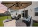 Spacious patio with outdoor furniture and a grill for entertaining at 291 Lucca Dr, Summerville, SC 29486