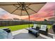 Outdoor patio with furniture, umbrella, and backyard view at 291 Lucca Dr, Summerville, SC 29486