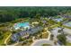 Aerial view of community pool, water slides, clubhouse, tennis courts, and lush landscaping at 2997 Sturbridge Rd, Mount Pleasant, SC 29466