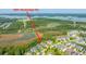 Stunning aerial view of coastal homes on the marsh with lush trees and water views at 2997 Sturbridge Rd at 2997 Sturbridge Rd, Mount Pleasant, SC 29466