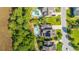 Aerial view of backyard with a pristine private pool, lounge chairs, a fire pit, and beautiful landscaping at 2997 Sturbridge Rd, Mount Pleasant, SC 29466