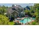 Aerial view of a beautiful brown home with solar panels and an amazing backyard pool and gazebo area at 2997 Sturbridge Rd, Mount Pleasant, SC 29466